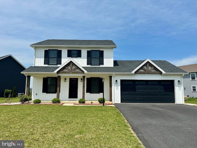 2040 Jelena Rd, Shippensburg, PA 17257 - modern farmhouse style home with board and batten siding, driveway, a garage, a front yard, and roof with shingles