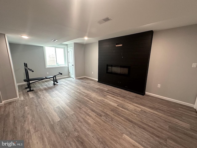 2040 Jelena Rd, Shippensburg, PA 17257 - workout room featuring wood finished floors, baseboards, and a large fireplace