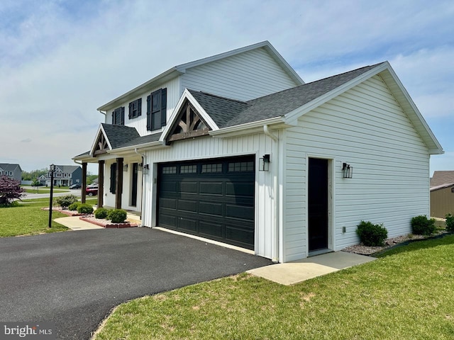 2040 Jelena Rd, Shippensburg, PA 17257 - view of front of property with roof with shingles, a front yard, driveway, and a garage