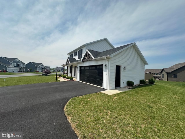2040 Jelena Rd, Shippensburg, PA 17257 - view of front of home featuring asphalt driveway, a front lawn, a shingled roof, and a residential view
