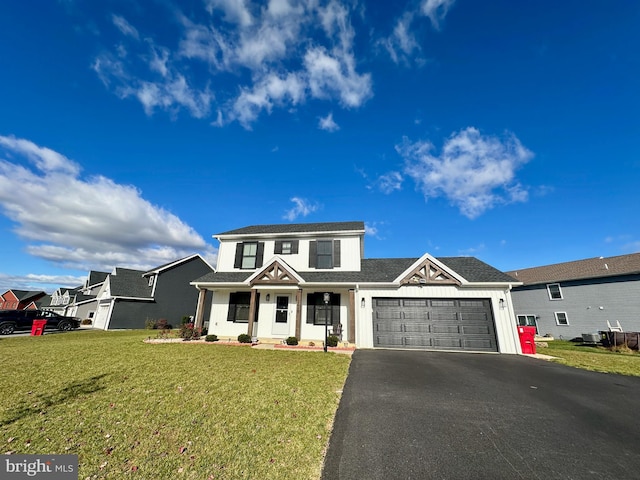 view of front of property with a porch, a garage, and a front lawn