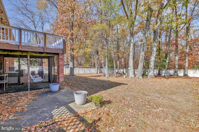 view of yard with a wooden deck