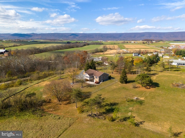 drone / aerial view featuring a mountain view and a rural view