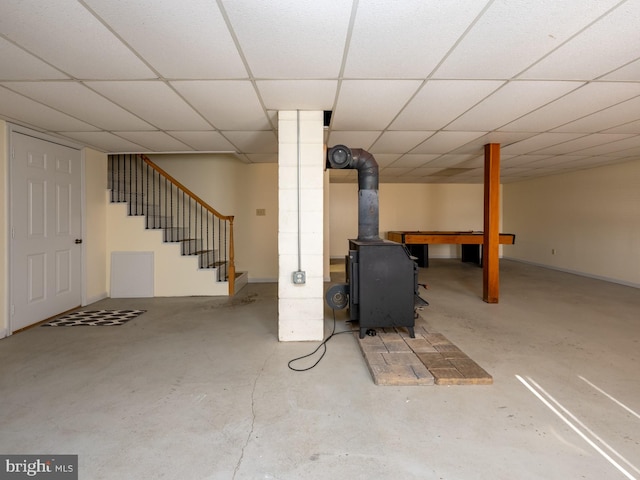 basement with a paneled ceiling