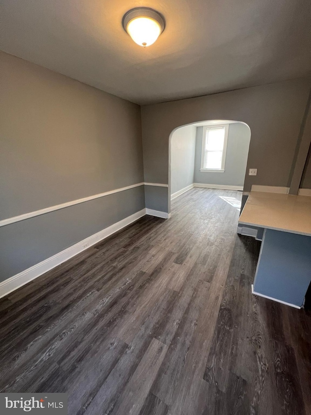 empty room featuring dark hardwood / wood-style flooring