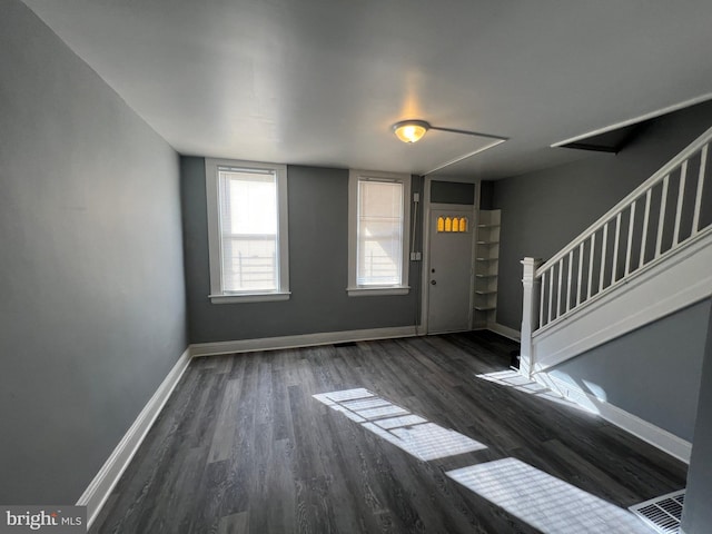 entrance foyer featuring dark wood-type flooring