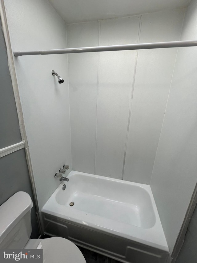 bathroom featuring toilet and bathtub / shower combination