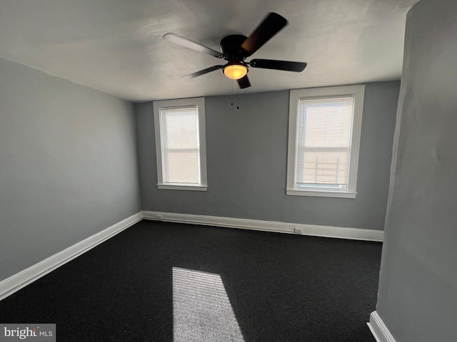 unfurnished room with carpet flooring and ceiling fan