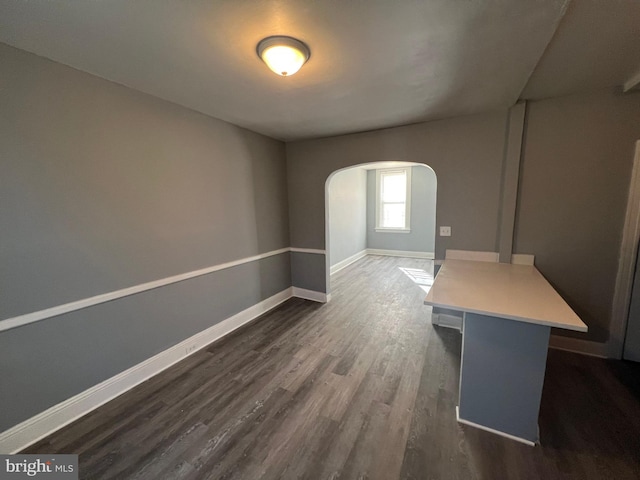 unfurnished room featuring dark hardwood / wood-style flooring