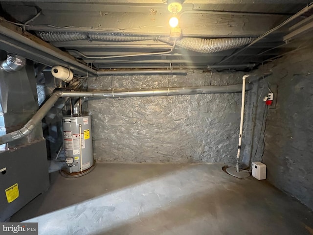 basement featuring water heater and heating unit