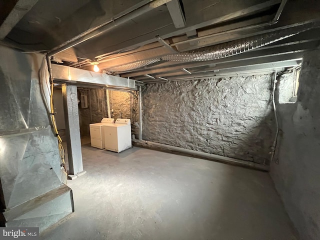 basement with washing machine and clothes dryer