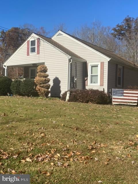 view of home's exterior featuring a yard