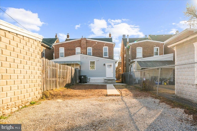 rear view of property featuring cooling unit