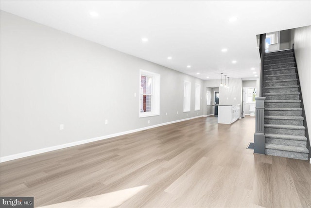 unfurnished living room featuring light hardwood / wood-style floors