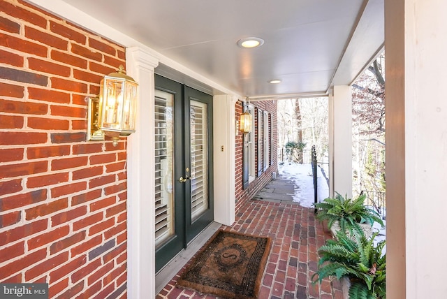 view of snow covered property entrance