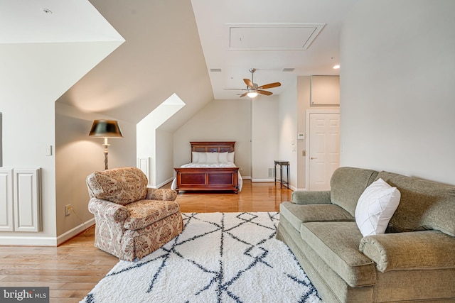 living room featuring light hardwood / wood-style floors and lofted ceiling