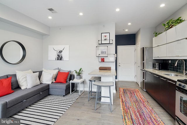 1343 Lombard St Unit B, Philadelphia, PA 19147 - living room with light wood-style flooring and recessed lighting