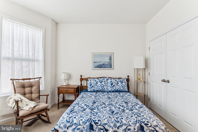 carpeted bedroom featuring a closet