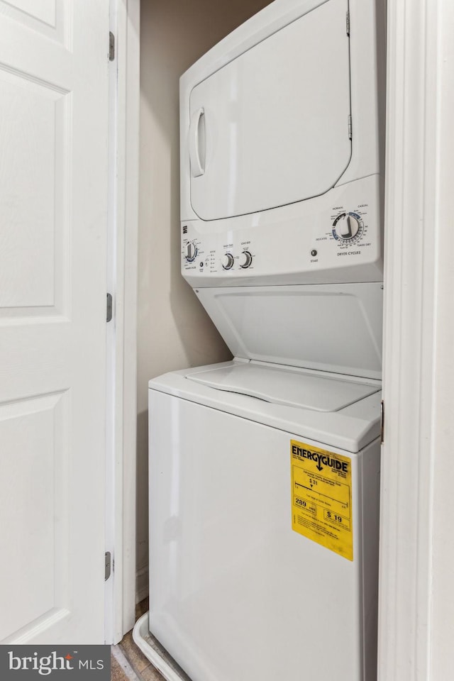 laundry area with stacked washer and clothes dryer