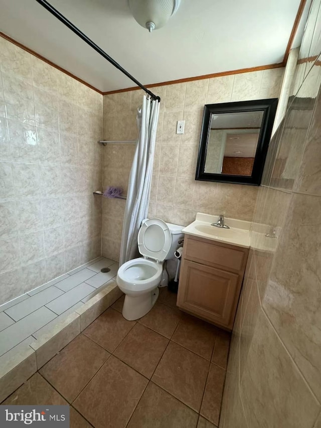 bathroom with walk in shower, tile patterned flooring, vanity, and tile walls