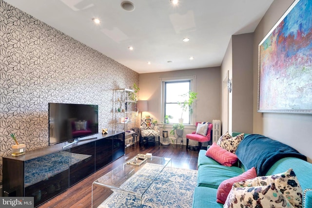 living room featuring radiator and dark wood-type flooring