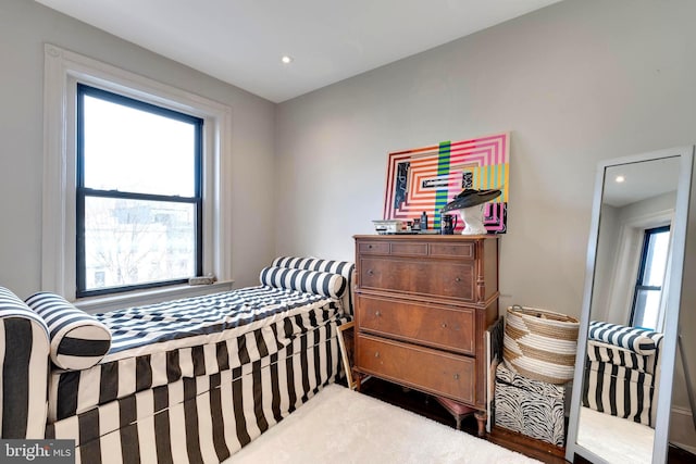 bedroom featuring multiple windows