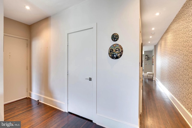 corridor featuring dark hardwood / wood-style flooring