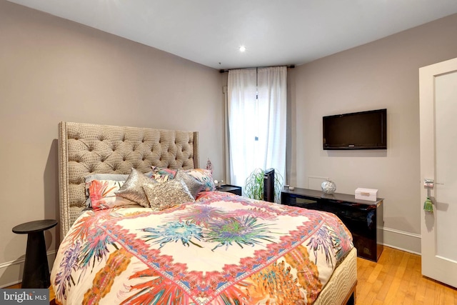 bedroom featuring light hardwood / wood-style floors