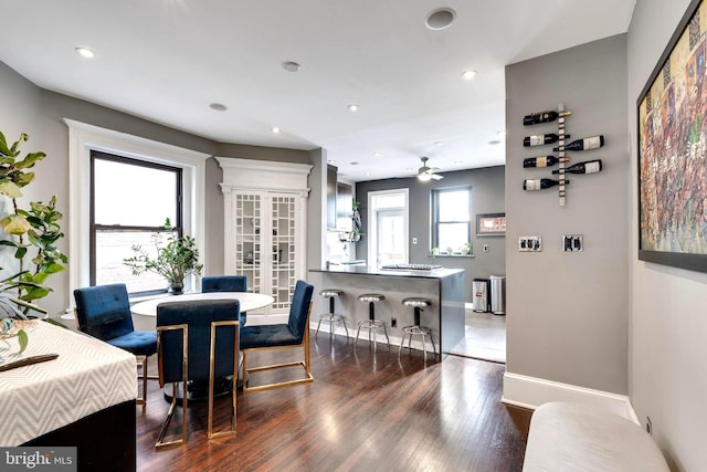 dining room featuring dark hardwood / wood-style floors and ceiling fan