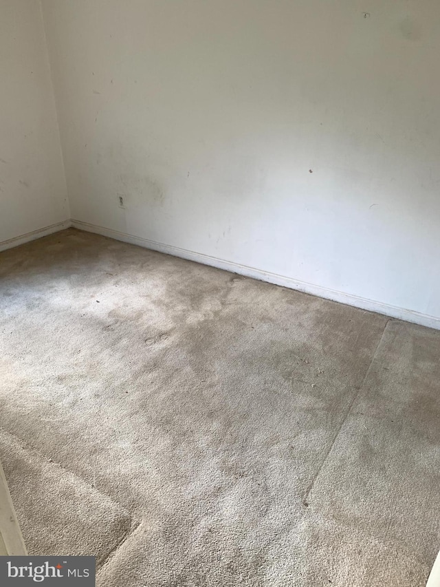 unfurnished room with carpet flooring