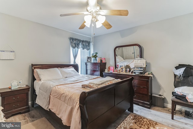 bedroom featuring ceiling fan and light wood-type flooring