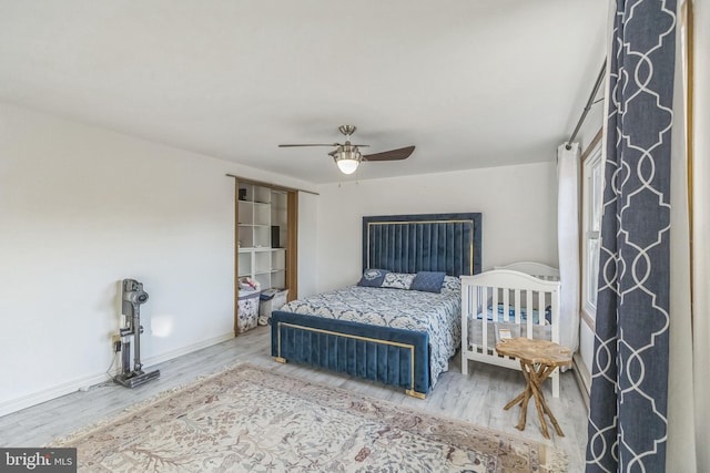 bedroom featuring ceiling fan and wood-type flooring