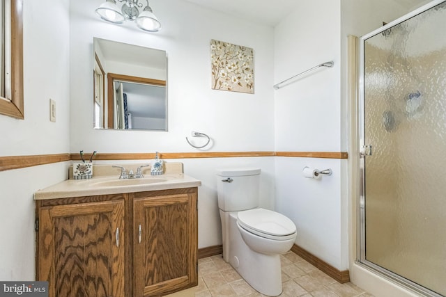 bathroom with vanity, toilet, and walk in shower