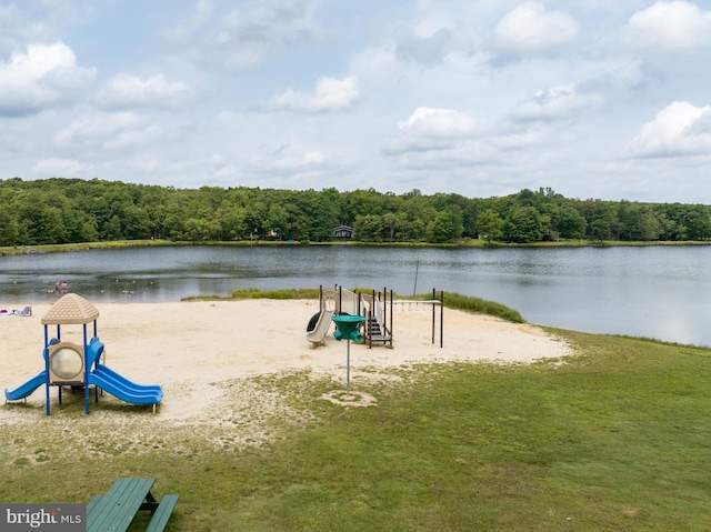 surrounding community with a playground and a water view