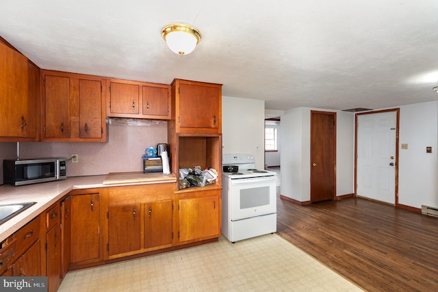 kitchen with light hardwood / wood-style floors and white electric stove