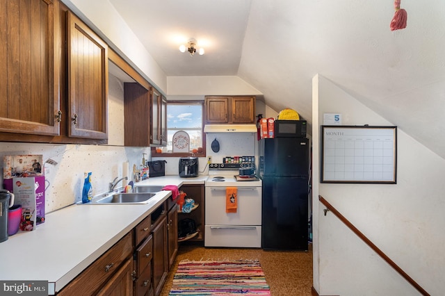 kitchen featuring white appliances, sink, and lofted ceiling