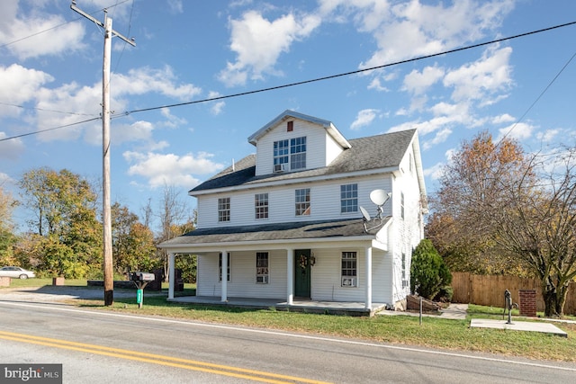 view of front of property with a front lawn and a porch