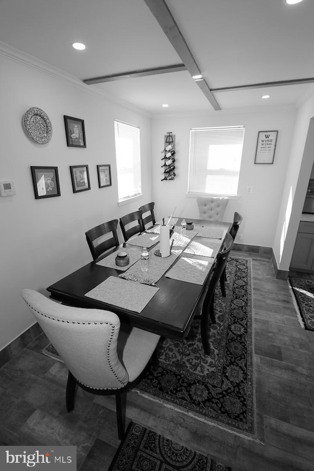 dining room featuring dark hardwood / wood-style flooring, beam ceiling, and crown molding