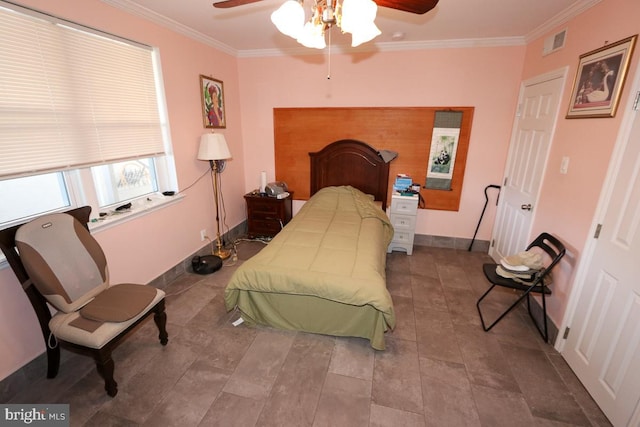 bedroom with ceiling fan and crown molding