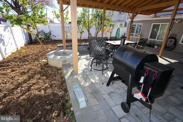 view of patio / terrace with an outdoor fire pit