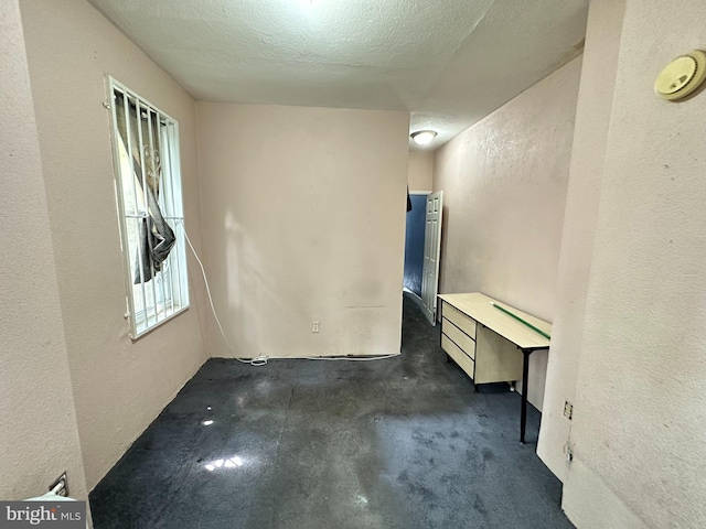 empty room with a textured ceiling