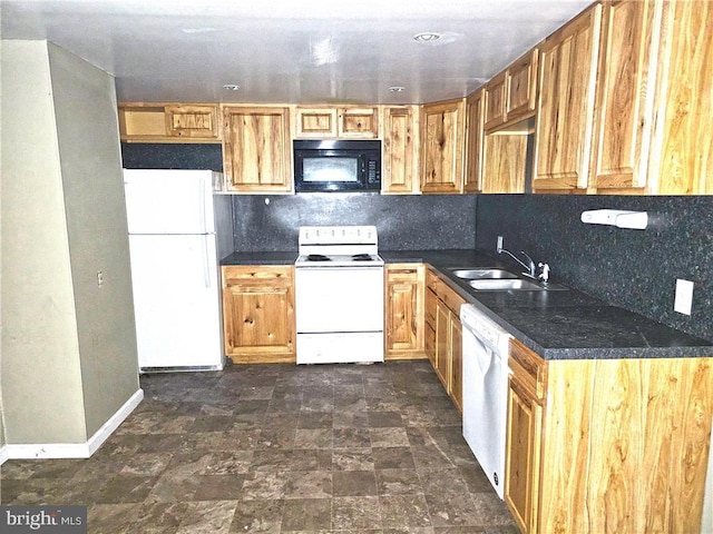 kitchen featuring white appliances, sink, and backsplash