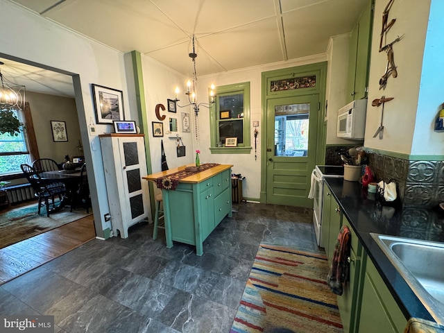 kitchen with a chandelier, white appliances, dark hardwood / wood-style floors, and butcher block counters