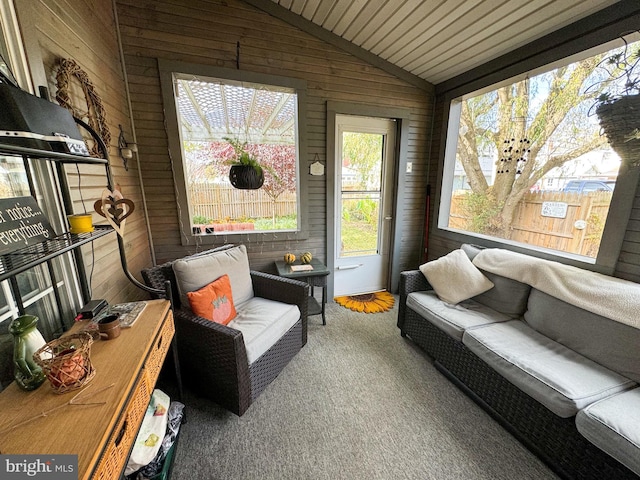 sunroom featuring lofted ceiling