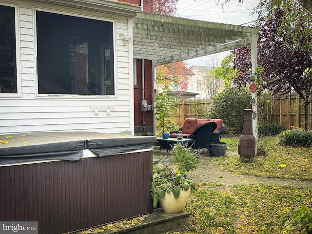 doorway to property with a hot tub