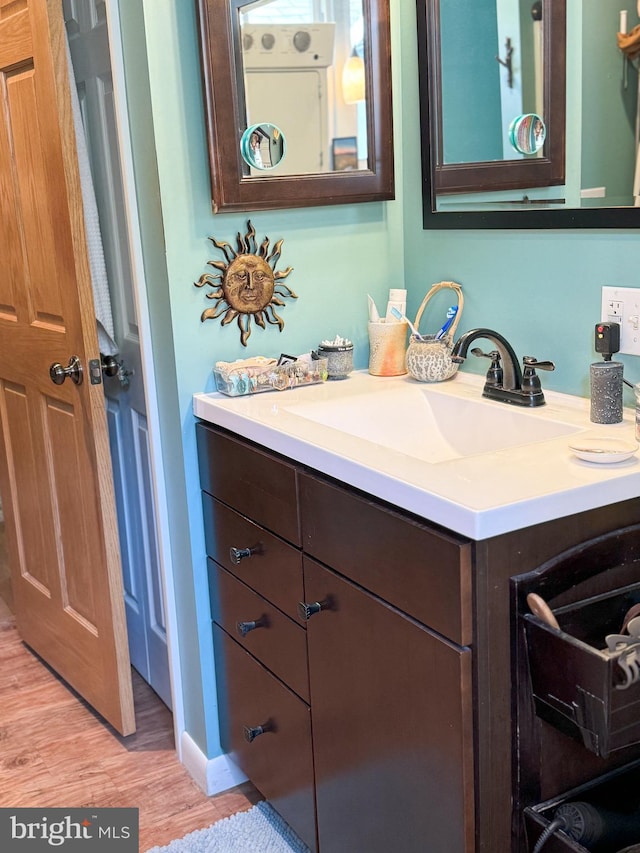 bathroom with hardwood / wood-style flooring and vanity