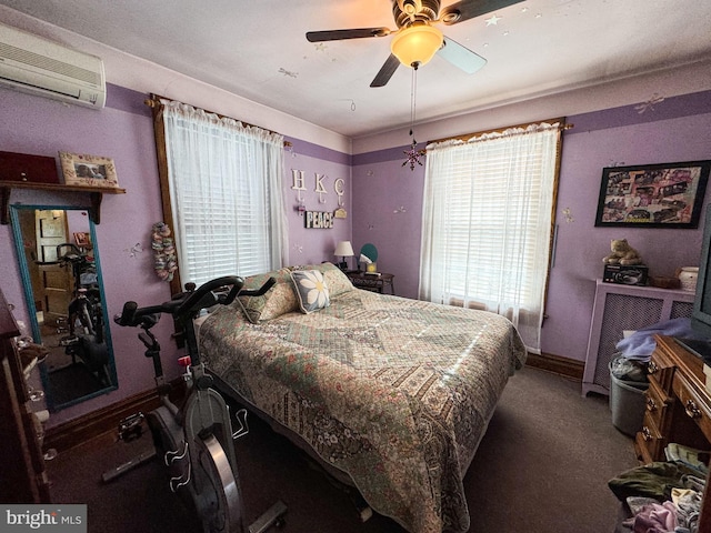 bedroom featuring carpet, an AC wall unit, and ceiling fan