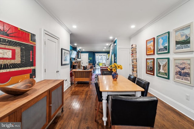 dining space with dark wood-type flooring and crown molding