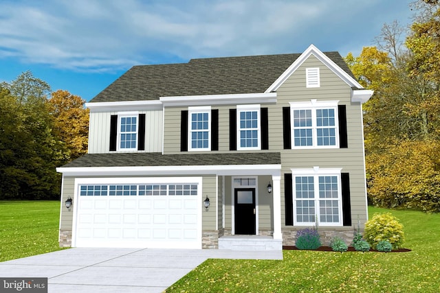 view of front of home with a garage and a front lawn