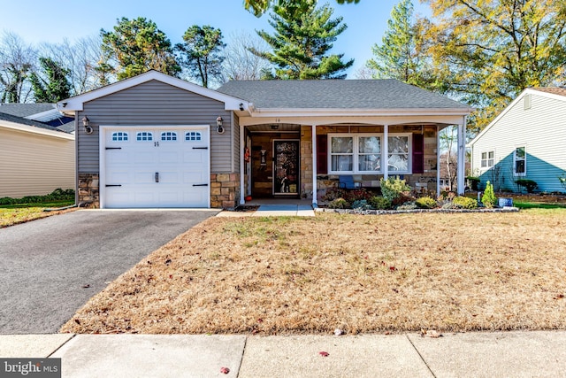 single story home with a garage and a front yard